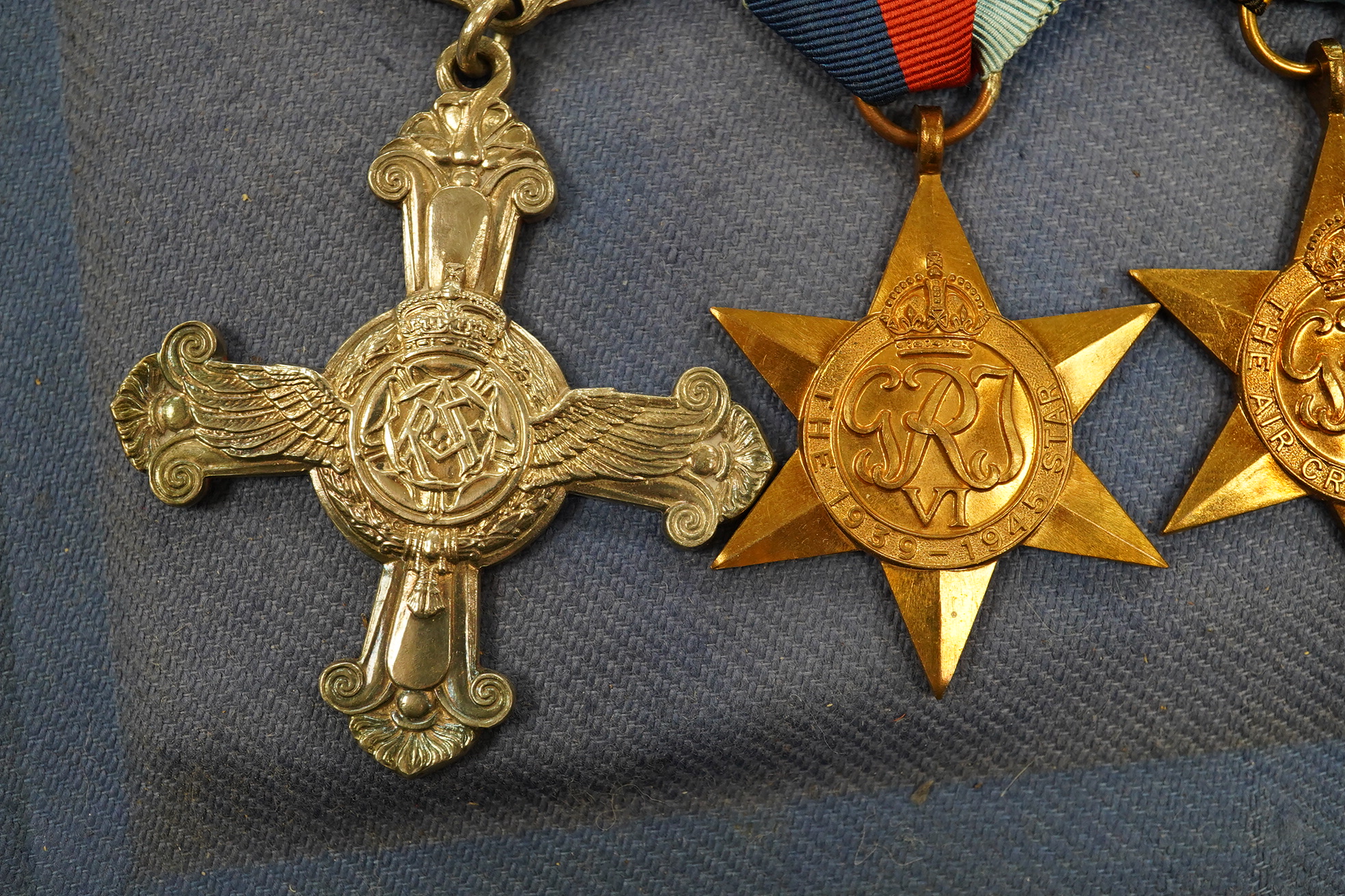 A DFC medal group with an Air Crew Europe star in a display case. Condition - good